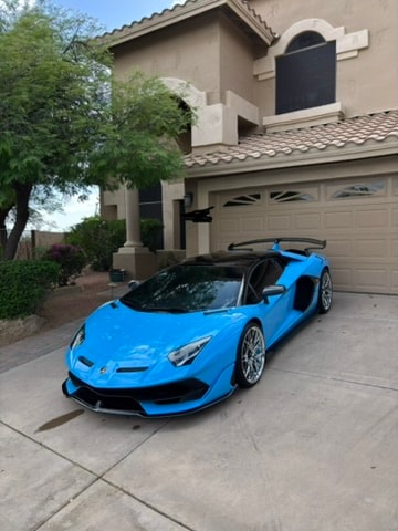 Luxury blue supercar exterior detailing